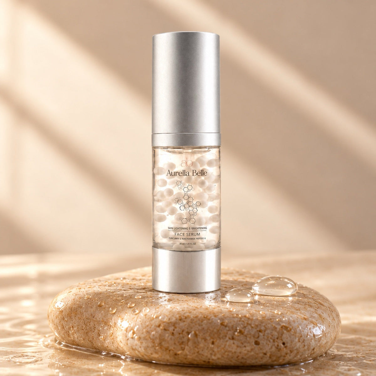 Brightening face serum on wet beige stone