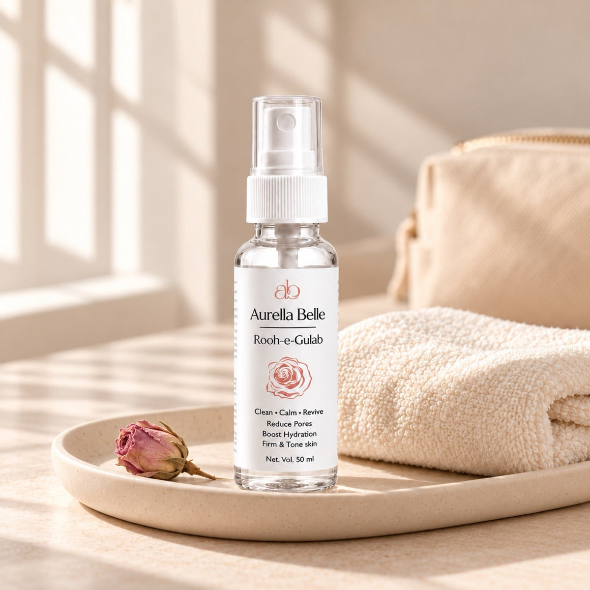 Rooh-e-Gulab 50 ml on a ceramic tray with a folded towel